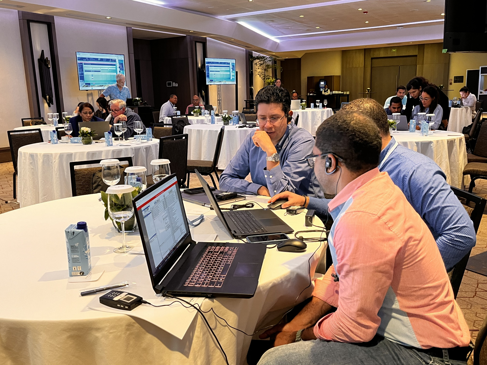 Participants simulating the use of an emission trading system, learning about carbon pricing