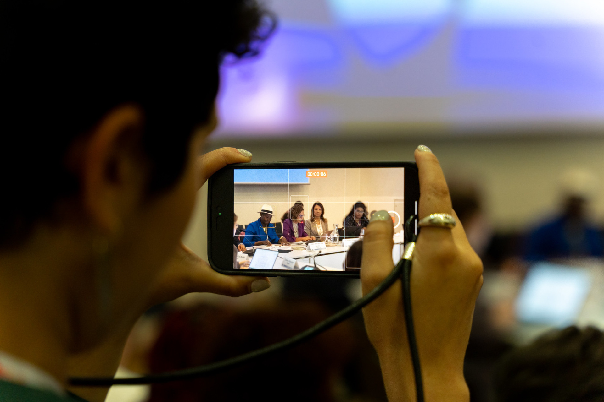 SB62 participant takes photo during event