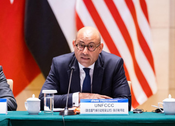 Simon Stiell addresses delegates in Wuhan, China