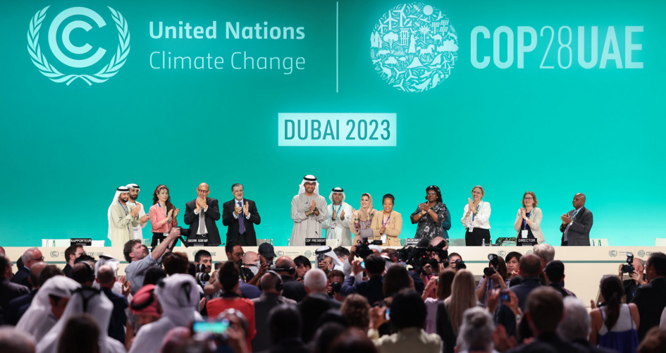 Delegates at COP28 applaud the final decision text at COP28