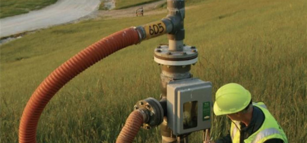 Man in hard hat by landfill gas